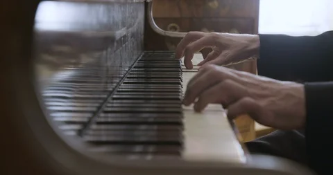 Two hands playing the piano Stock Footage 97524674