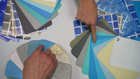 Two hands pointing on different swatches for swimming pool. Top view Stock Footage 291881314