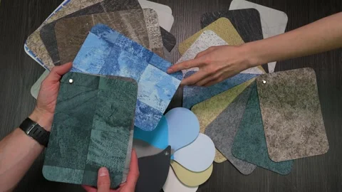 Two hands pointing on different swatches of PVC film for swimming pool covering Video stock 310571501