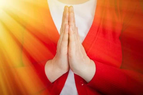 Two hands in prayer position praying to God Stock Photos