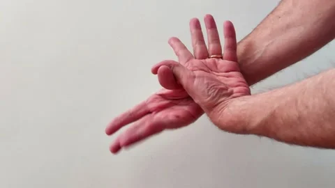 Two Hands Press Together in Gesture Against Plain Light Background 스톡 동영상 329213521