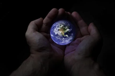 Two hands protect the earth globe Stock Photos