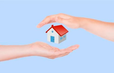 Two hands protecting house Stock Photos