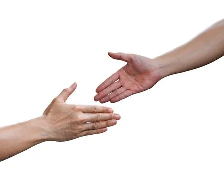 Two hands reaching for each other isolated on white background Stock Photos