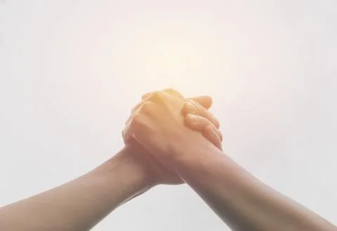 Two hands reaching toward each other. Teamwork and helping concept. Foto stock