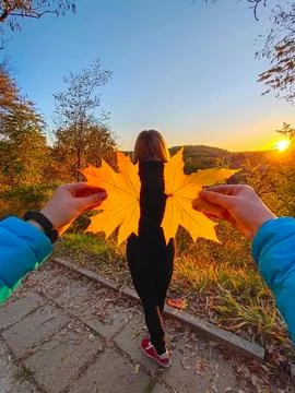 Two hands represent two leaves to the woman, depicting wings for her Stock Photos