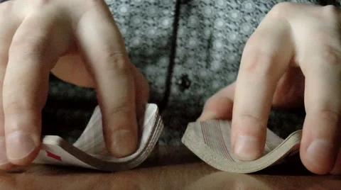 Two hands shuffling a deck of cards Stock Footage 43036218