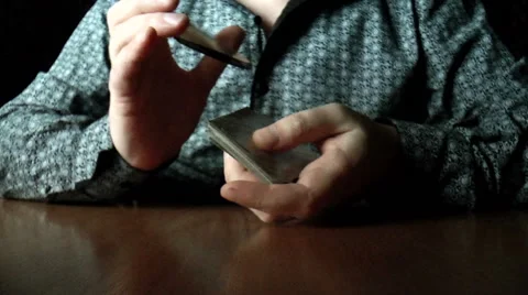Two hands shuffling a deck of cards Видео 43037967