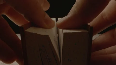 Two hands slowly opening a book as the camera moves forward. Stock Footage 162719699