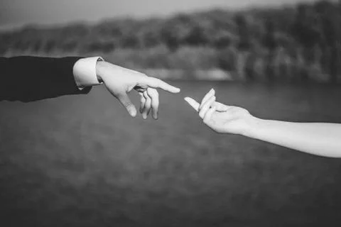 Two hands stretch to each other Stock Photos