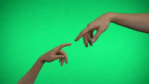 Two hands touch with fingers on a green background. Video stock 163600199