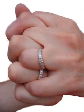 Two hands two rings and two hearts Stock Photos