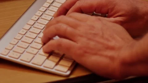 Two Hands Typing on Computer Keyboard Close Up 2 Stockbeeldmateriaal 231072930