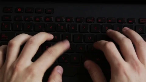 Two hands typing on keyboard filmed from above. Stock Footage 79510618
