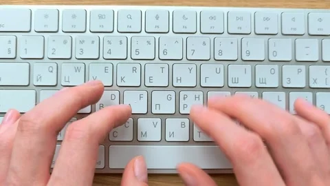 Two hands typing on a modern keyboard from above. Top view of fingers movin.. Stock Footage 343261160