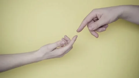 Two hands uncertainly touch each other. Painting by Michelangelo. Background Video stock 132453973