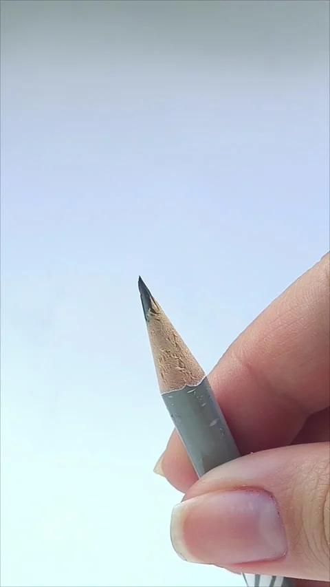 Two hands using pencil sharpener to sharpen pencil 스톡 동영상 313104750