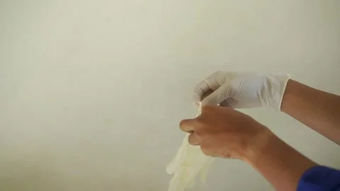 Two hands wearing nitrile gloves on a white background Video stock 322205964