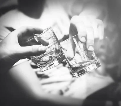 Two hands with whiskey Stock Photos
