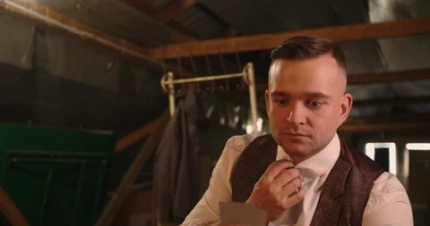 Two handsome elegant men playing illegal cards game . They checking their card c Stock Footage 117672922