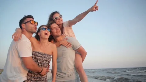 Two Handsome Strong Men with Their Girlfriends Smiling and Laughing on the Stock Footage 80533865