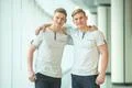 The two handsome twin stand near the panoramic window Photo