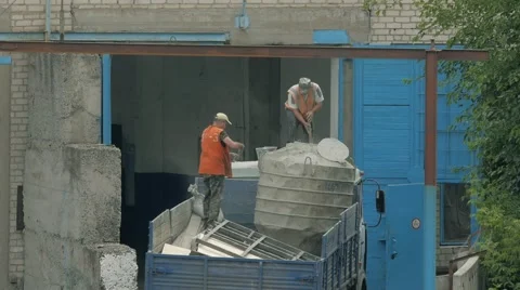 Two handymen are working in the back of a truck. Workers prepare to unload cargo Stock Footage 64941947