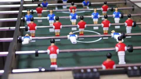 Two happy and joyful friends together playing table football in the playing Stock Footage 228678437