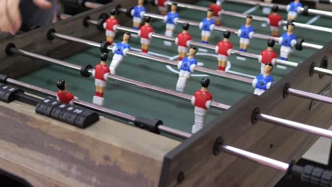 Two happy and joyful friends together playing table football in the playing Stock Footage 228678525