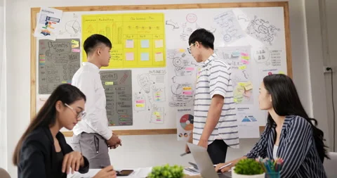 Two happy asian young men shaking hands to seal a deal with his partner  Stock Footage 201845092