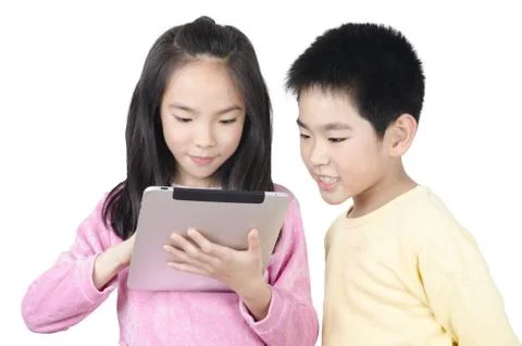 Two happy children using touch pad computer and isolated on white Stock Photos