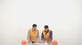 The two happy engineers with a drawing discuss on the white background 4k or 4k+ Resolution