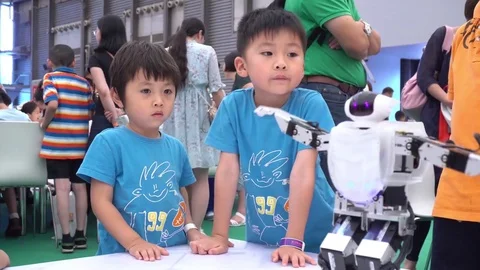 Two Happy Kids Exploring Robotic Technology Video stock 77175808