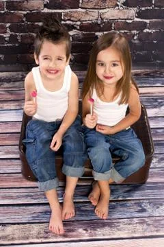 Two happy kids in studio Stock Photos