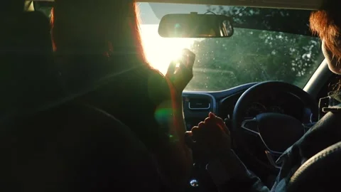 Two happy redhead young female friends dancing having fun driving car road trip Stock Footage 265302968