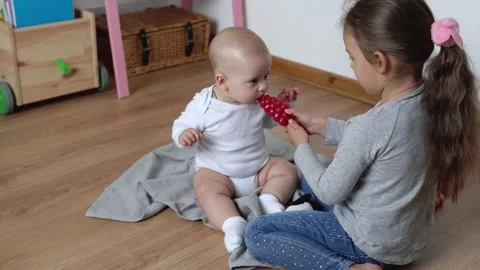 Two Happy Siblings Children Boy Girl In Playing Room. Kids Infand and Preschool Stock Footage 192582144