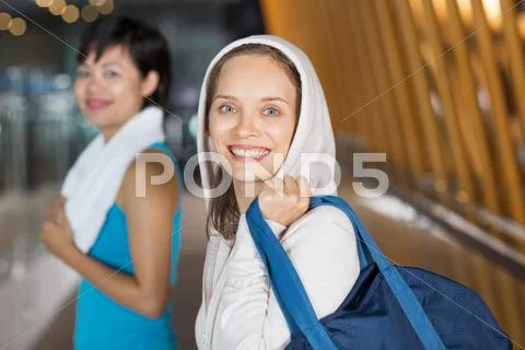 Two Happy Sportswomen in Gym Hall after Training Stock Photos