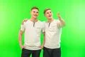 The two happy twin brother gesture on the green background Photo