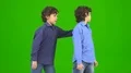 The two happy twin kids gesture on the green background 4k or 4k+ Resolution