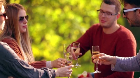 Two happy young couples celebrating outdoors Video stock 118899276
