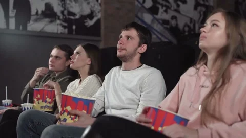 Two happy young couples at the cinema Stock Footage 131164046