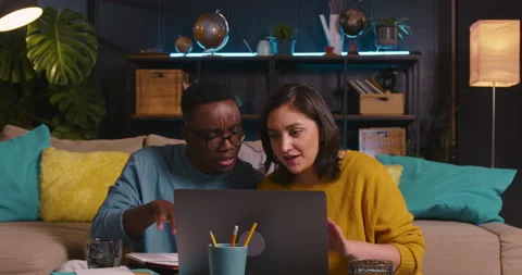 Two happy young multiethnic student friends study, work online together using Stock Footage 170073725
