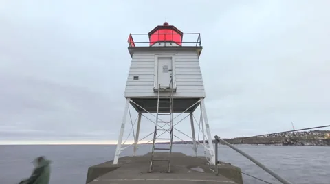 Two Harbors Breakwater Lighthouse Sunset Blue Hour Cloudy Winter Evening 4K UHD Stock Footage 63108442
