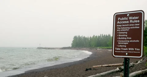 TWO HARBORS, MN - 17 JUN 2024: Sign of rules at beach on Lake Superior Stock Footage 283191286