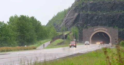 TWO HARBORS, MN - 17 JUN 2024: Cars, rain, highway and a tunnel Stock Footage 283234501