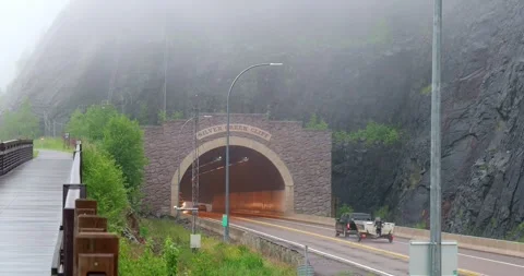 TWO HARBORS, MN - 18 JUN 2024: Traffic at a Minnesota tunnel Stock Footage 288164337
