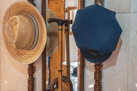 Two hats on a coat rack Stock Photos