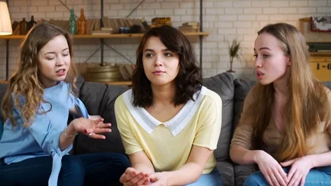 Two haughty girls Mock the third one, who is depressed and very sad Video stock 75052159