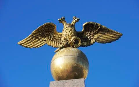 Two headed golden eagle obelisk in the market square in Helsinki, Finland Stock Photos