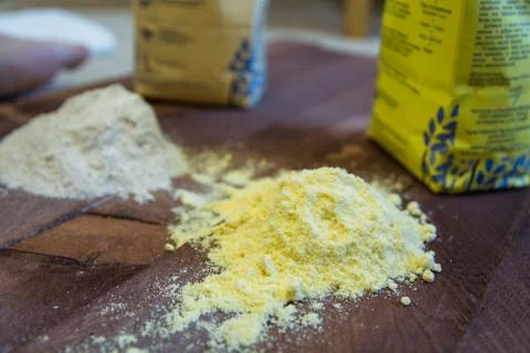 Two Heaps of Different Flour. Yellow One and Grey Another. Stock Photos